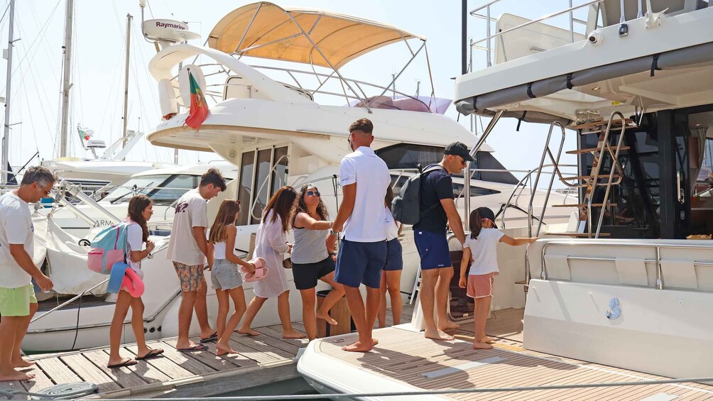 A group of people boarding a yacht. 2