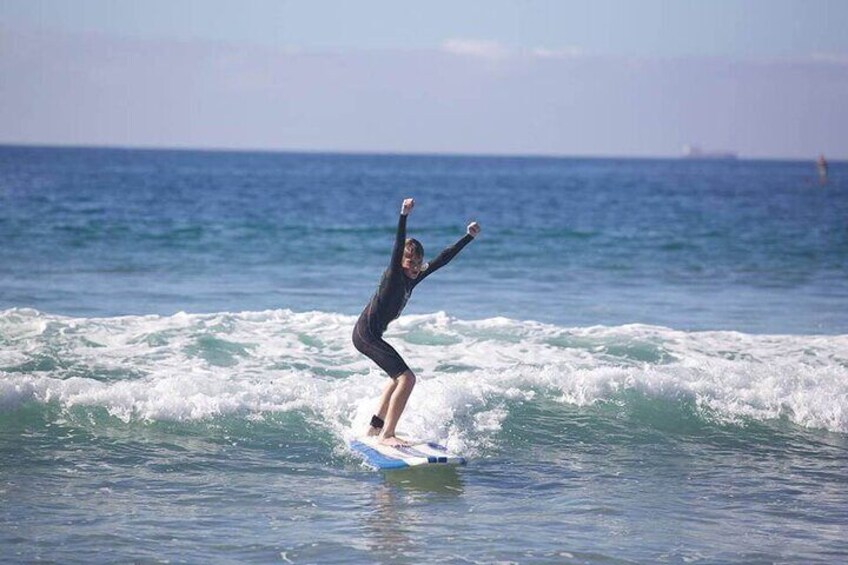 Boy cheers during a wave