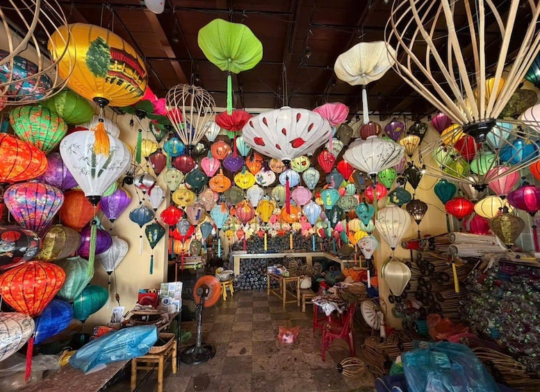 A room filled with various colorful paper lanterns hanging from the ceiling. 1