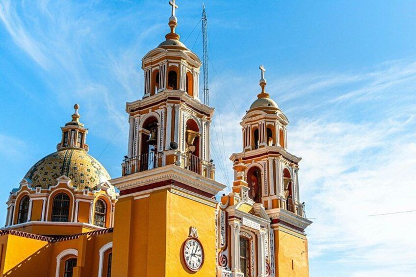 A church with three domes and bell towers. 4