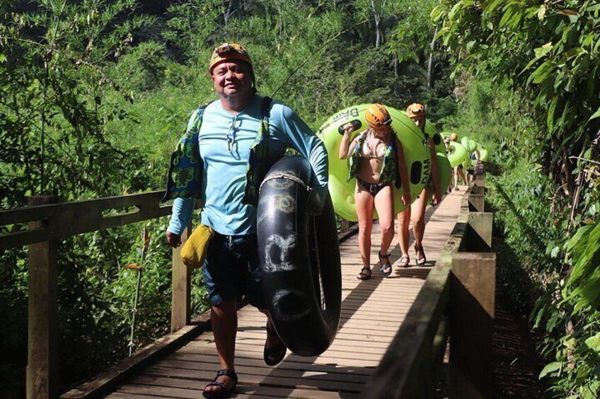 The lush jungle walk with tubes to the cave entrance 4