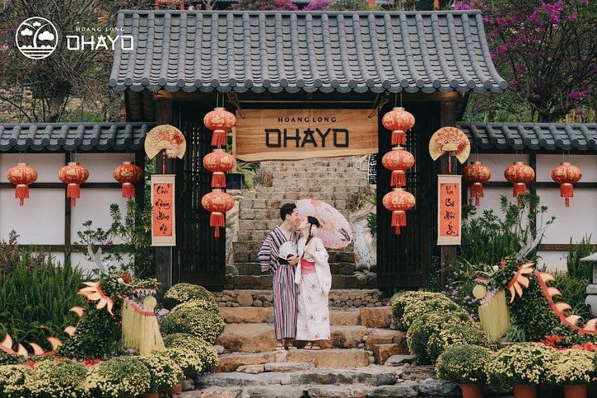 A traditional Chinese building with a tiled roof, red lanterns, and a sign that reads 'HOANGLONG OHAYO'. 3