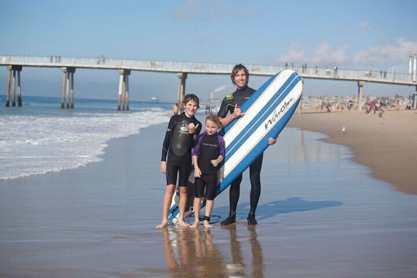 Happy kids and a stoked instructor snap a picture after a fun lesson.