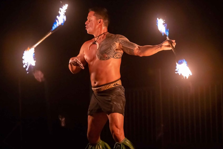 A performer juggling flaming torches. 2
