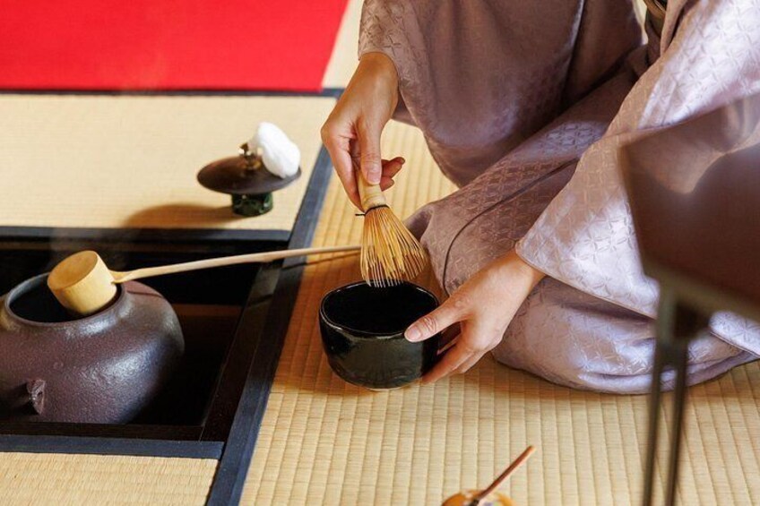 Preparing to whisk a bowl of matcha. 5