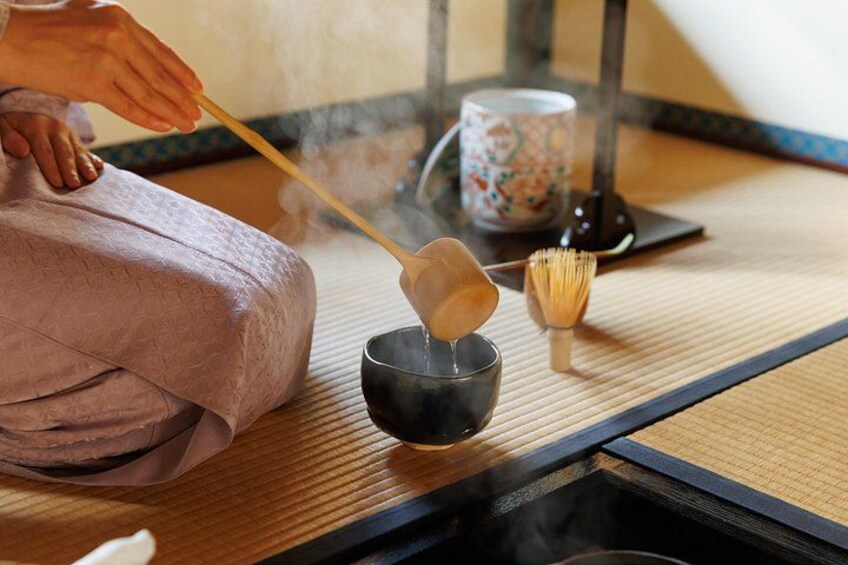 Adding hot water to a tea bowl. 2