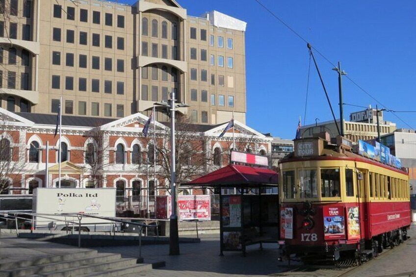 The city Tram's are ever present, here passing in front of the Old Post Office, with new hotel beyond 