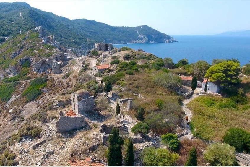 Ancient ruins, a coastal landscape, and a clear sky. 2