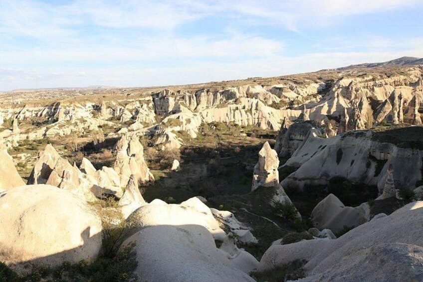 A landscape with numerous rock formations and a valley. 4