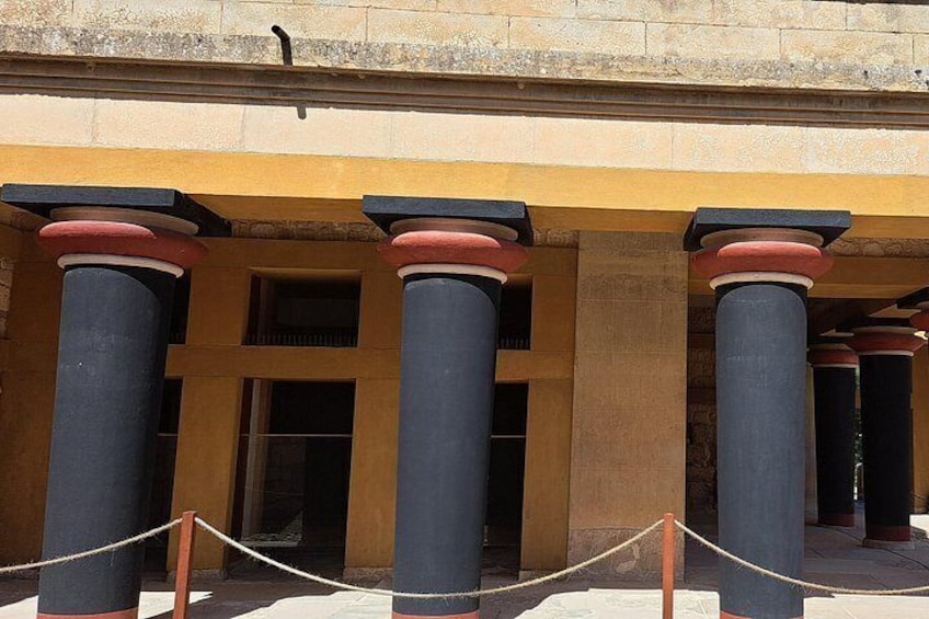 A building with columns and a rope barrier. 4