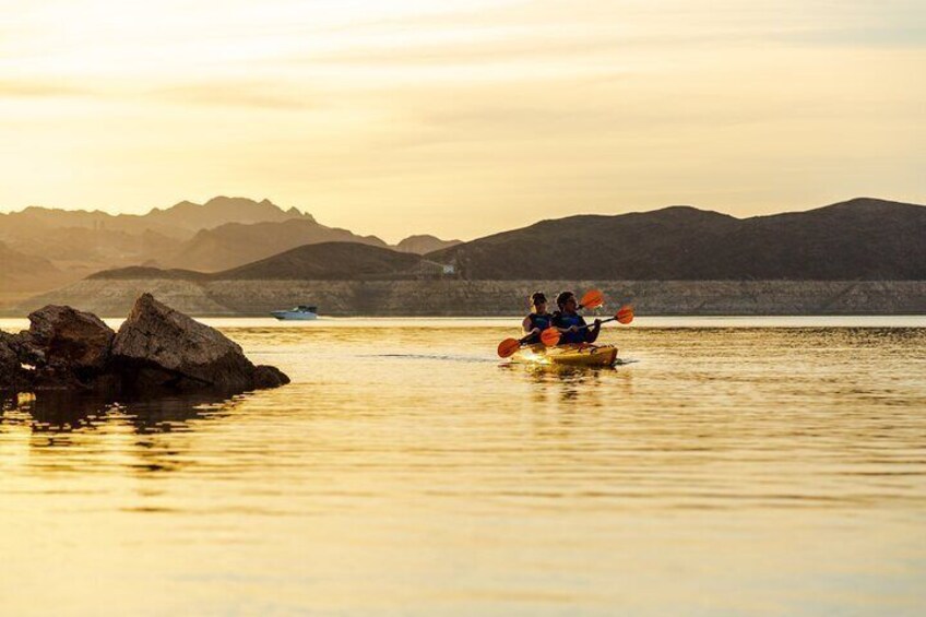 A kayak trip on calm water with mountains in the background. 5