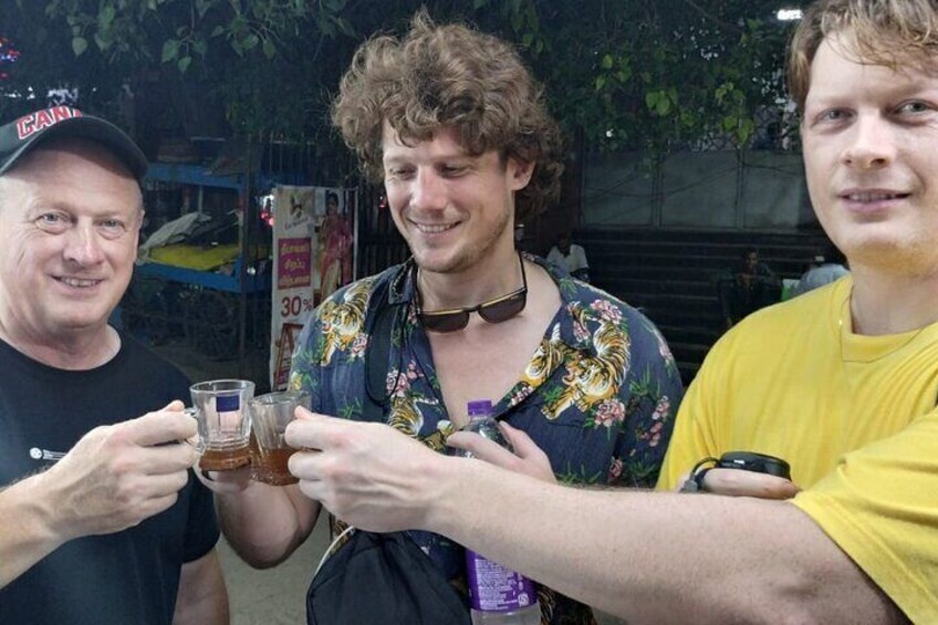 Three people holding glasses of beer. 3