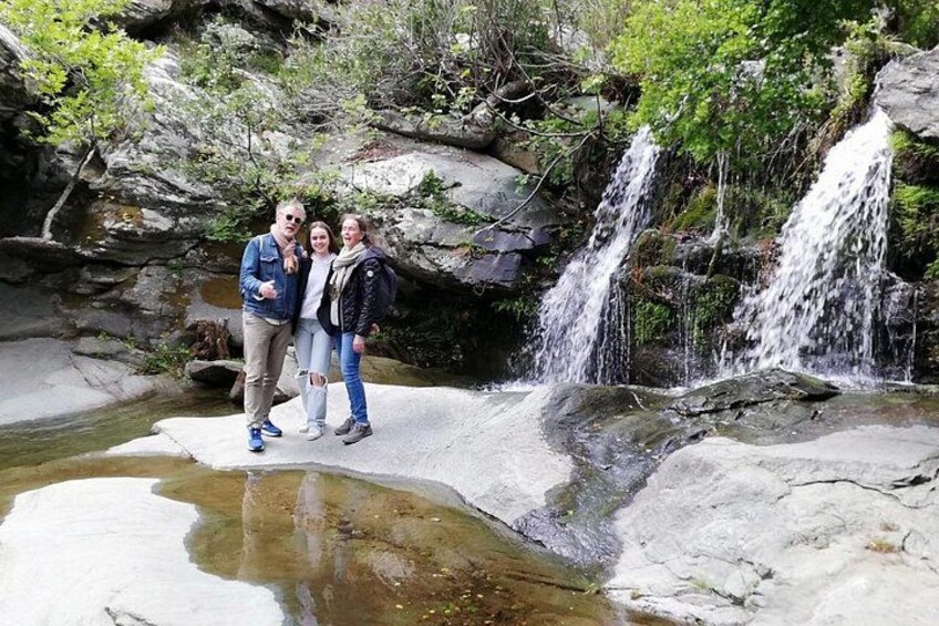 A waterfall, rocky terrain, and a small pool of water. 2