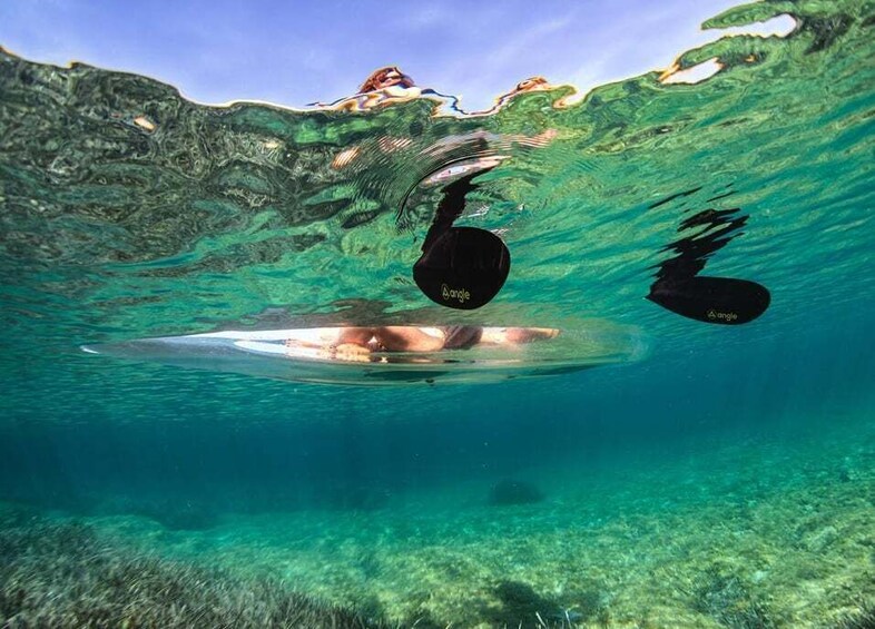 A person swimming underwater with a black object labeled 'angle' and another similar object nearby. 3