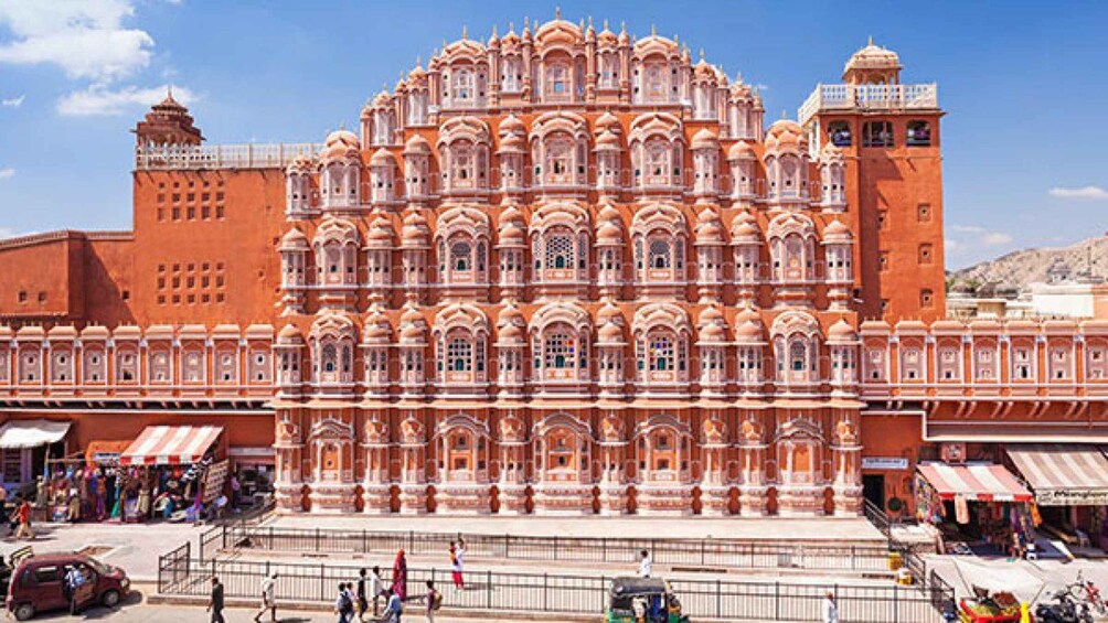 A large, ornate building with intricate architecture and a prominent tower. 3