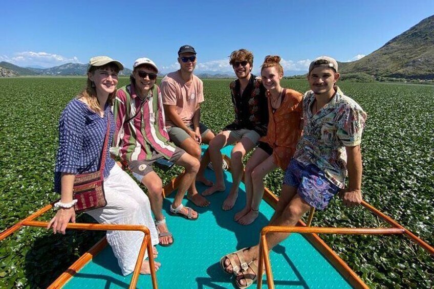 A group of people on a boat in a field. 3