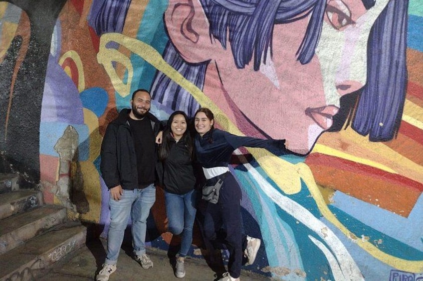 A mural with abstract patterns and a partial depiction of a person. 4