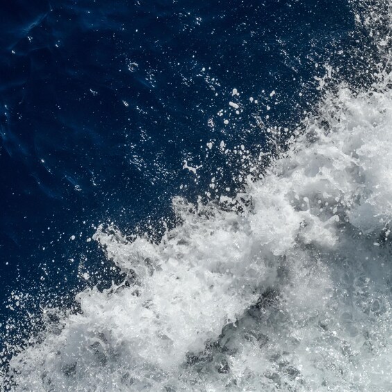 A close-up of ocean waves with white foam. 4