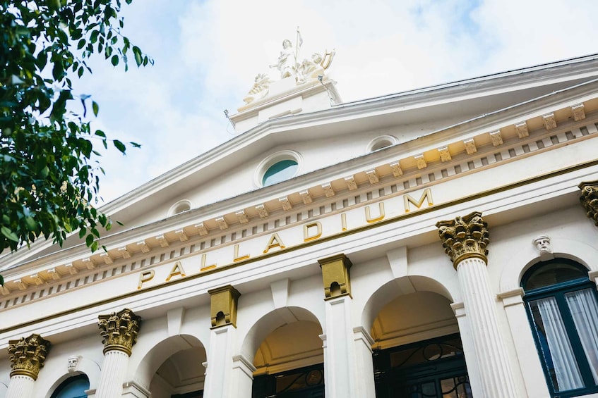 The exterior of the Palladium building with classical architecture, including columns and a decorative frieze. 4