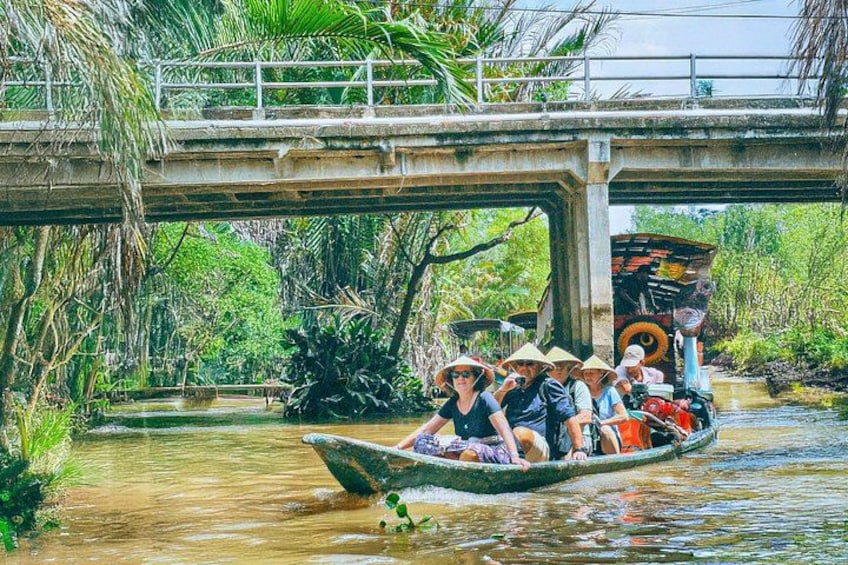 Rowed by locals through the calm, coconut-shaded canals 2