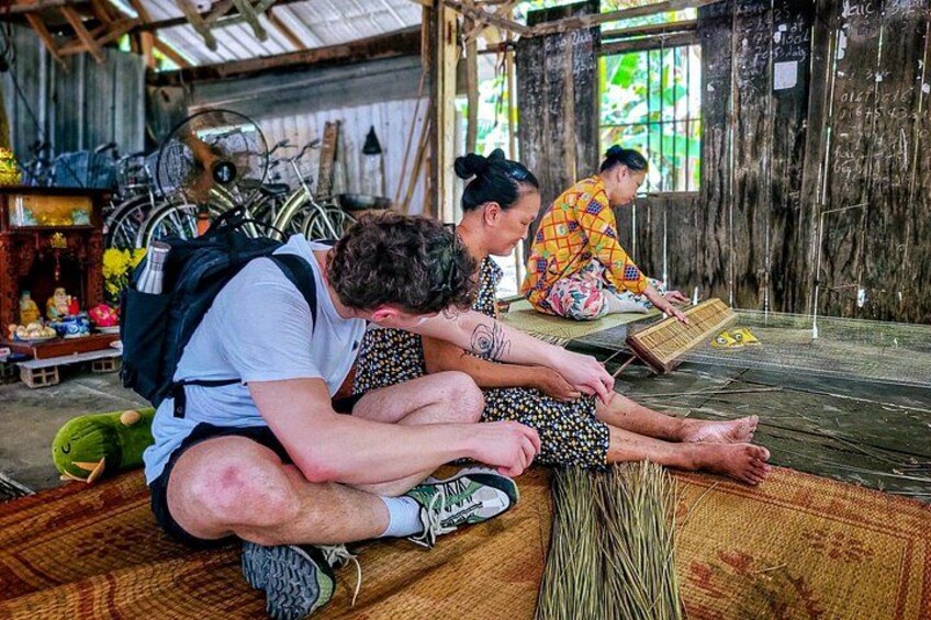 Seeing how the locals make sleeping mats. 2
