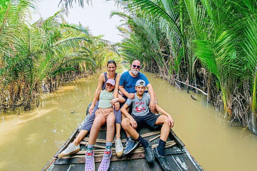 Taking photos in the coconut canal is one of the hot trend by visiting Ben Tre 2