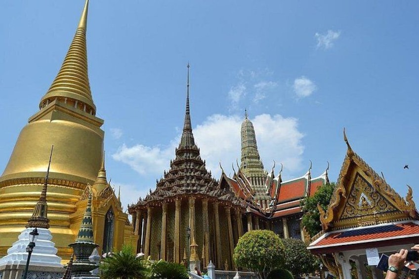 A temple complex with golden spires and intricate architecture. 1
