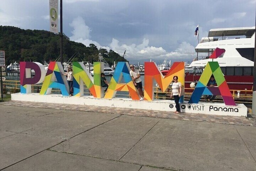 A colorful sign with the word "PANAMA" and a hashtag #VISIT Panama. 5