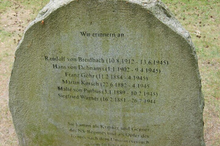 A gravestone with names and dates. 5