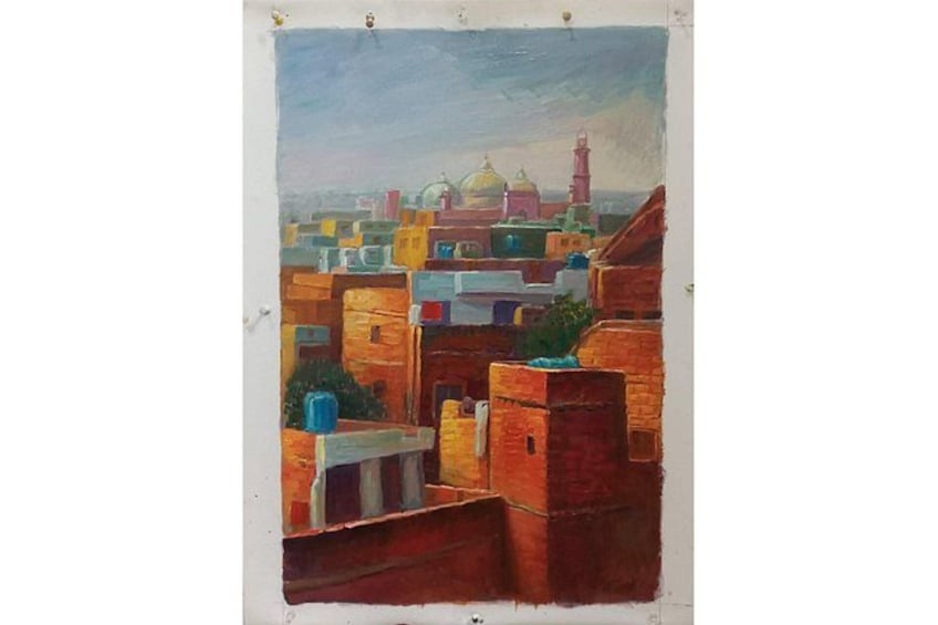 A cityscape with colorful buildings and a mosque with a dome in the distance. 2