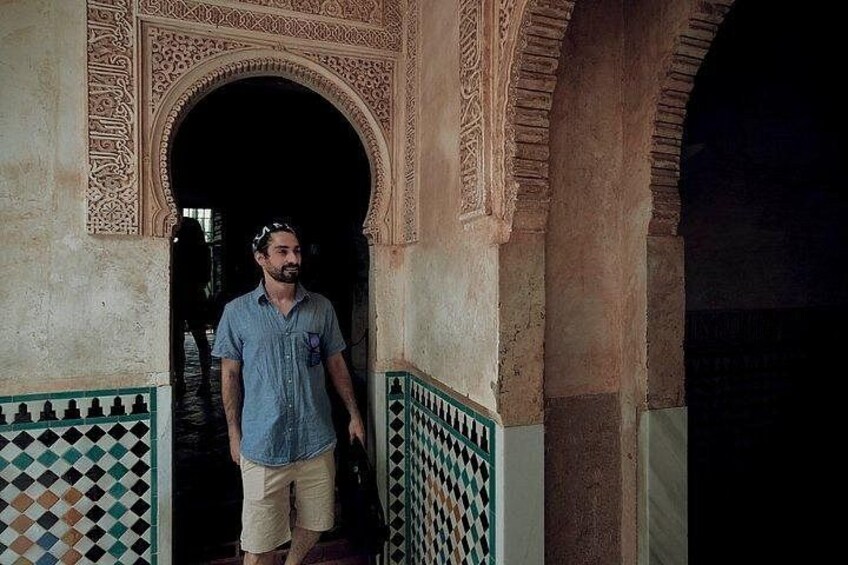 Traveler at doorway with tiles
Step through Alhambra’s iconic doorways where every tile tells a story of heritage, culture, and royal splendor. 2