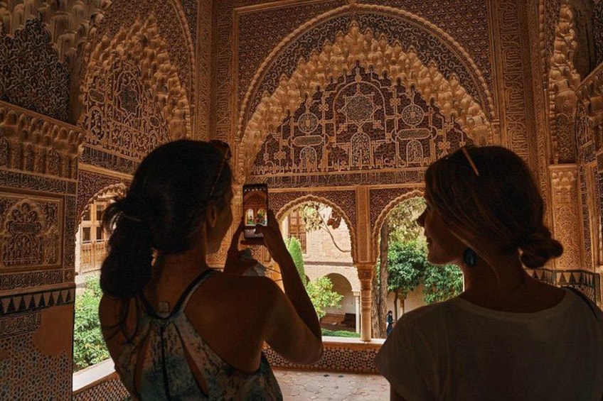 Visitors silhouetted in hall
Experience Alhambra’s magic in golden light, where every hall invites reflection and awe-inspiring discovery. 4