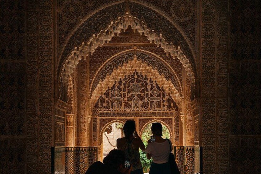 Women exploring ornate arches
Walk beneath Alhambra’s ornate ceilings—every detail a testament to Moorish craftsmanship and imagination. 5