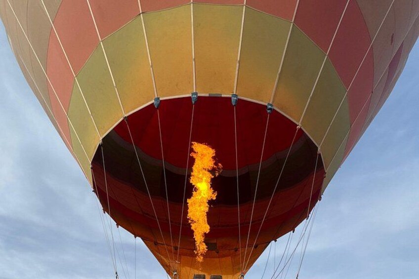 A hot air balloon with a visible flame at the bottom. 2