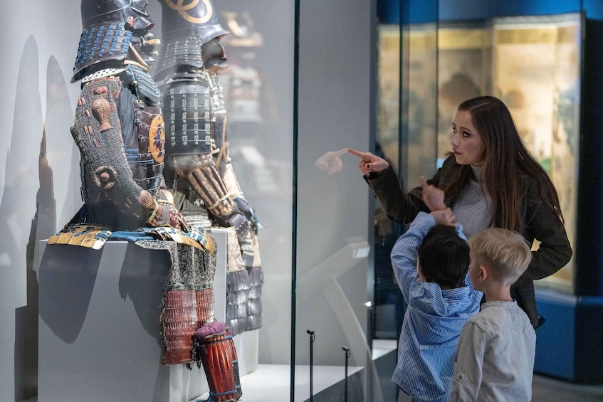 A museum exhibit with a life-sized samurai armor display. 2