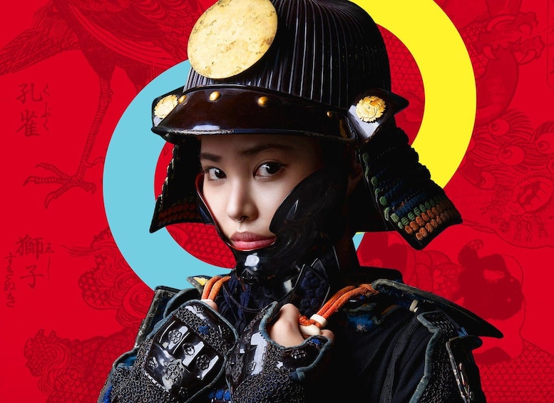 A person in traditional armor with a helmet, gloves, and a sword. 1