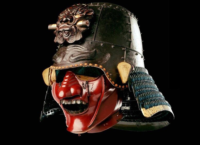 A samurai helmet with a red face mask and decorative elements. 3