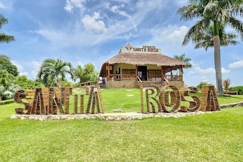 A thatched-roof hut labeled 'Santa Rosa' with a sign spelling out 'SANTA ROSA' in the foreground. 4