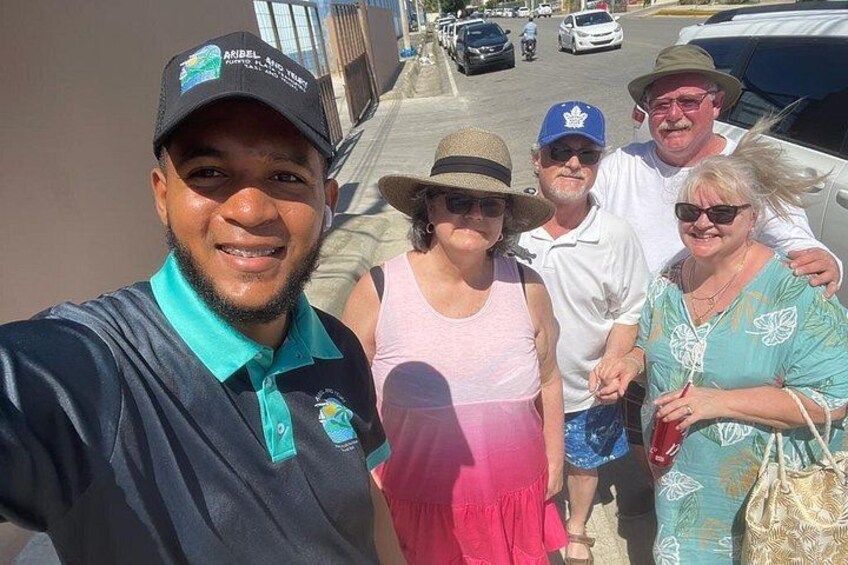 A group of people walking on a sidewalk. 4