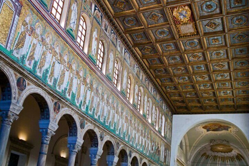 A grand hall with intricate mosaics, arched ceilings, and detailed frescoes. 2