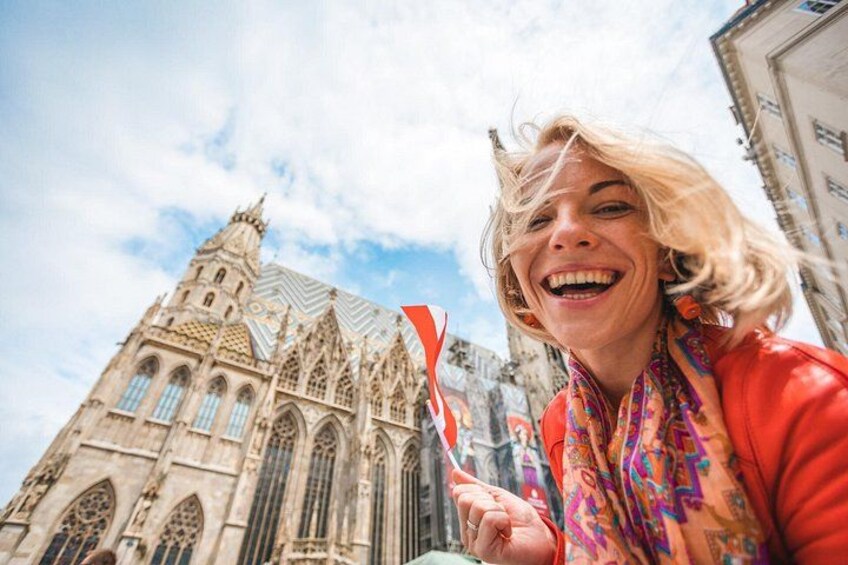 A person in front of a Gothic-style cathedral with pointed arches and a spire. 5