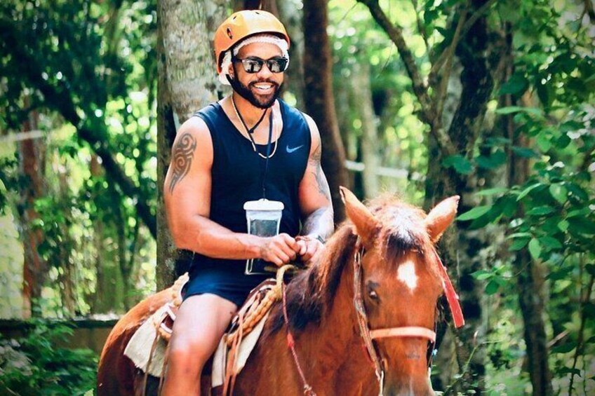 A person riding a horse in a wooded area. 1