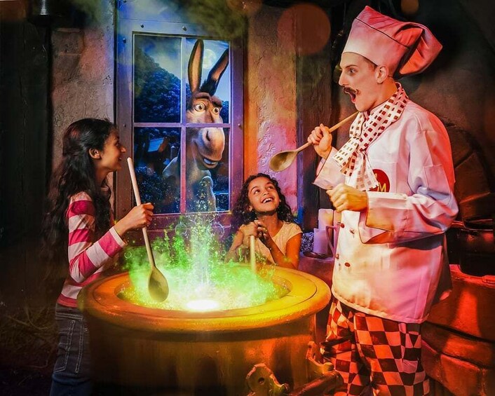 A person in a chef's outfit with a spoon stirring a pot. 4
