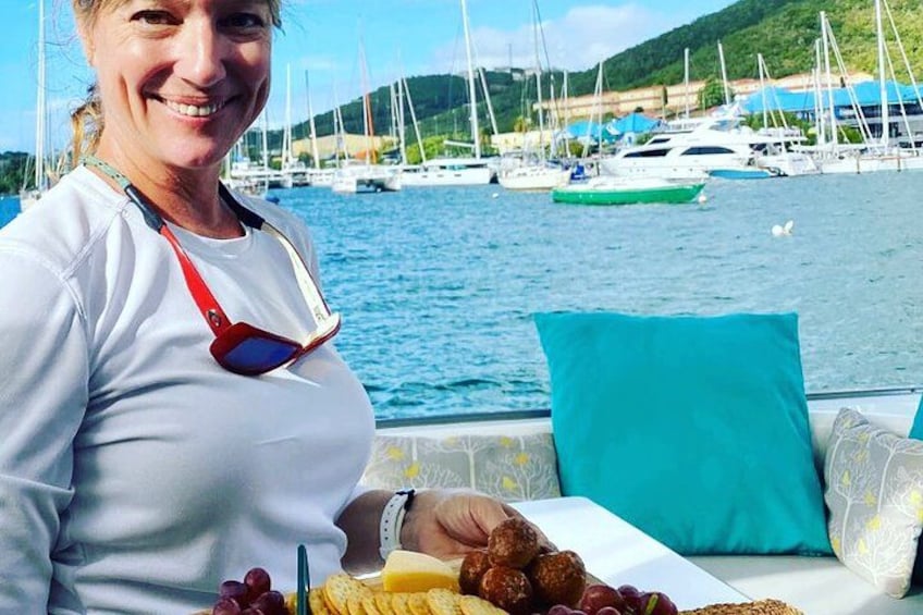 Friendly crew serve a charcuterie board 3