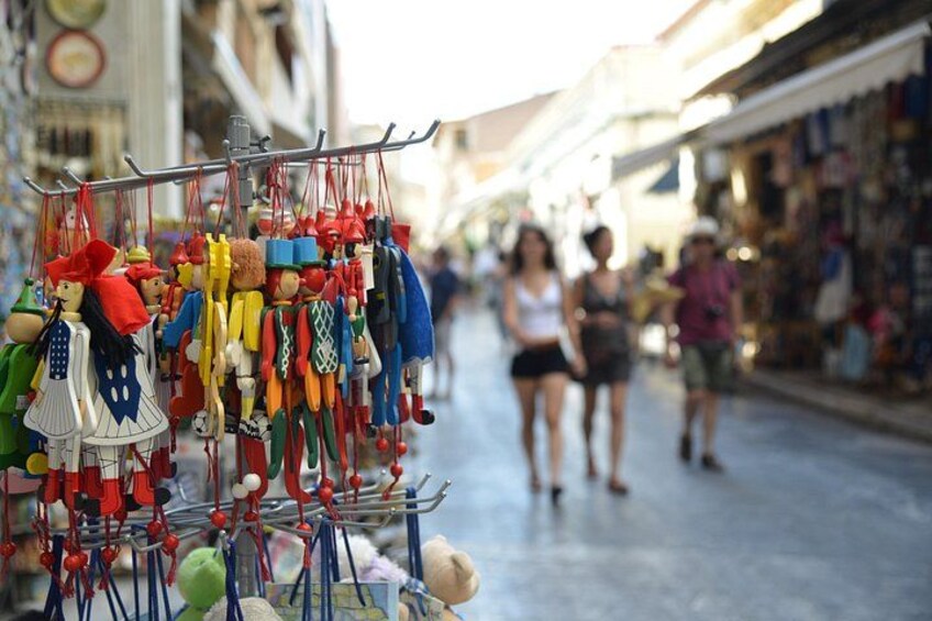A street market with various colorful items on display. 3