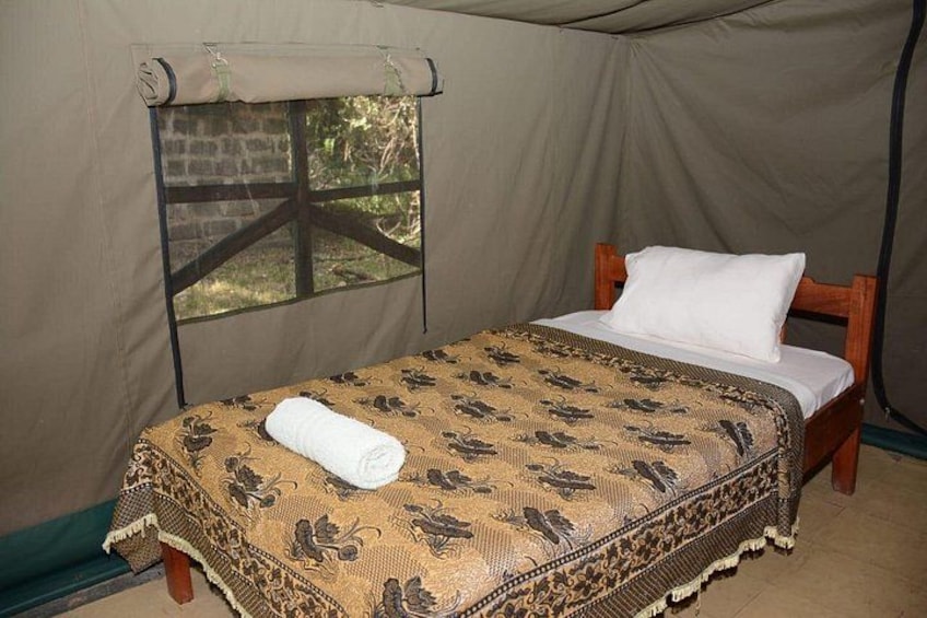 A tent with a bed inside. 3