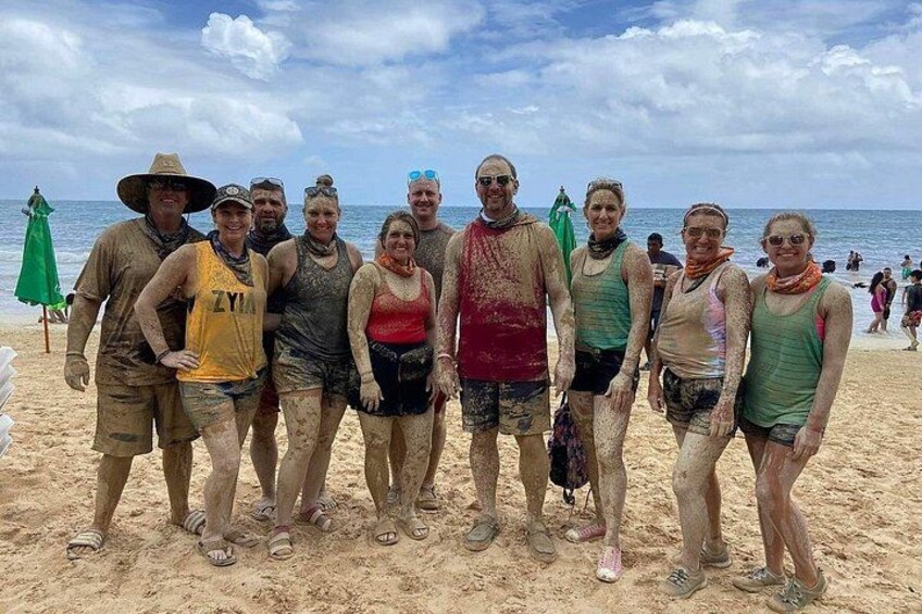 A group of people on a sandy beach with the ocean in the background. 5