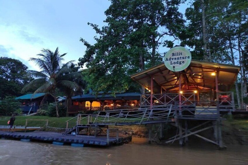 A lodge named Bilt Adventure Lodge with a covered deck and a dock extending into a body of water. 5