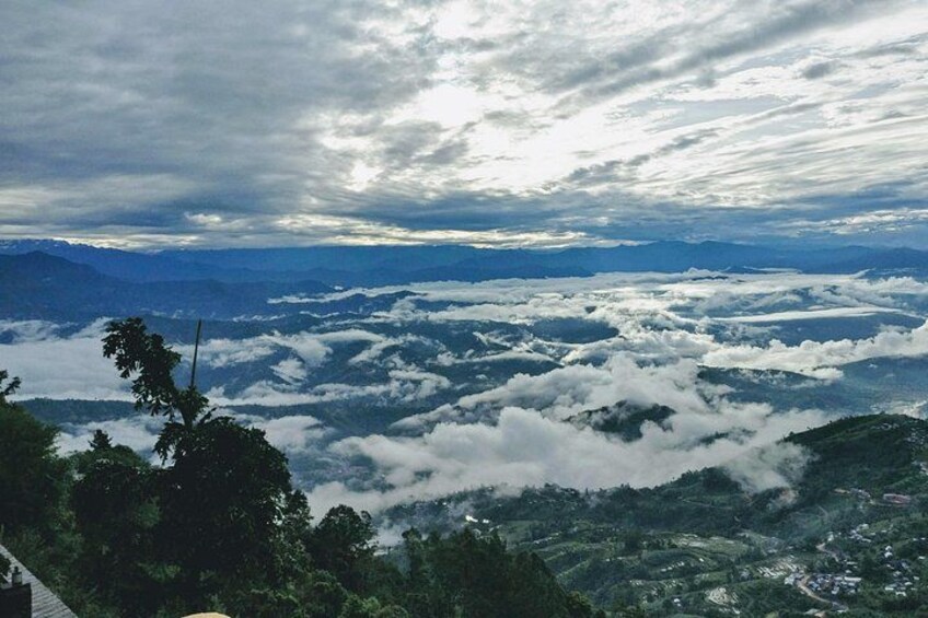 A mountainous landscape with cloud cover and a view of distant mountains. 4