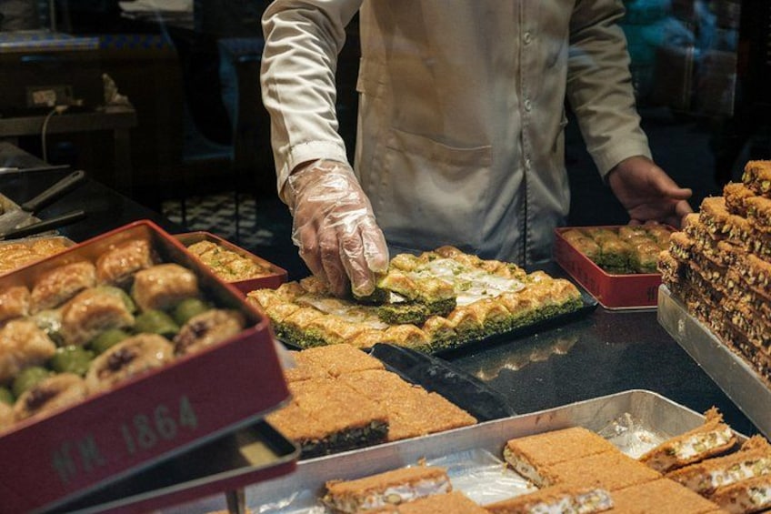 A person arranging food items on a table. 4